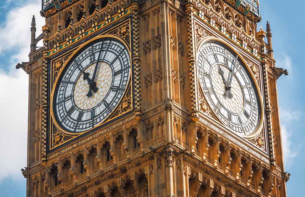 A close up of Big Ben's clock face in London, part of the House soft parliament, a popular attraction for tourists and London summer school students to visit