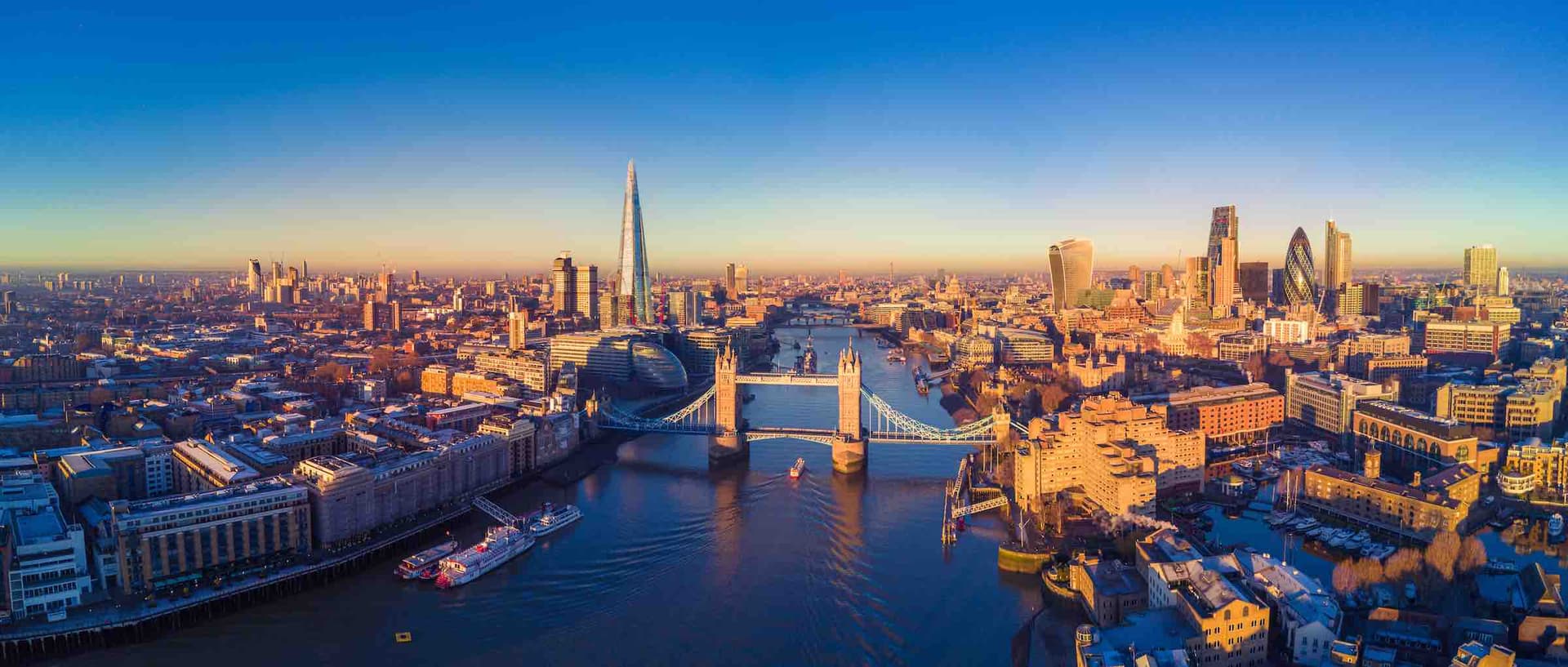 Tower Bridge and the London skyline beside the River Thames