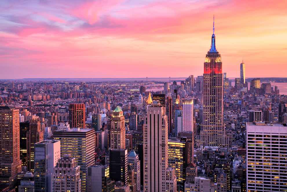 The New York skyline at sunset with the Empire State Building; a popular day trip for students at summer school in the USA